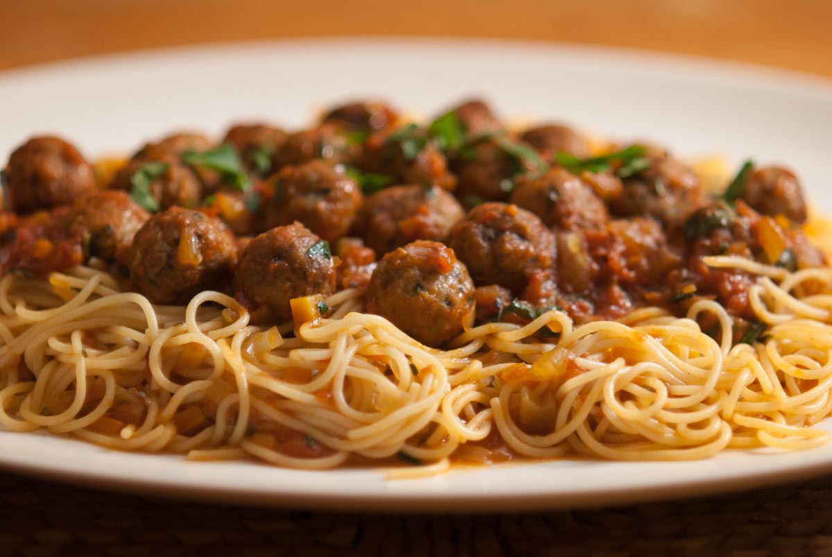 This is a clever way with meat balls. As small individual portions it makes an elegant Italian starter. The smaller-sized meatballs and thin spaghetti also make a fun and wholesome dish for children. Or piled high on a big platter it makes a great family dish to share around the table.