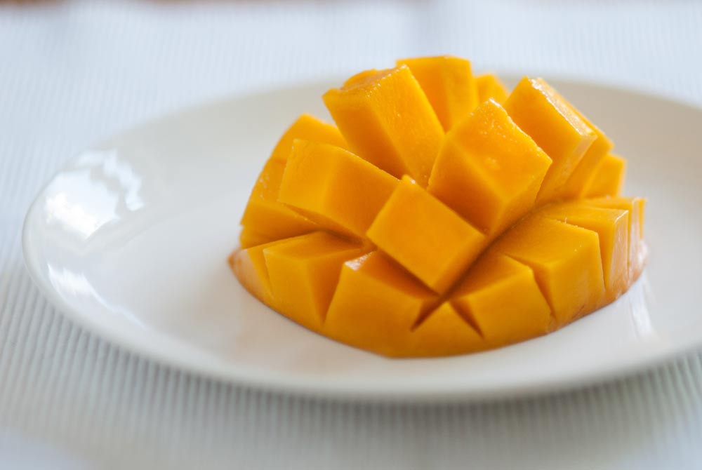 I first saw mangoes presented like this in the 1970’s. They were served by a very large charismatic Jamaican lady...