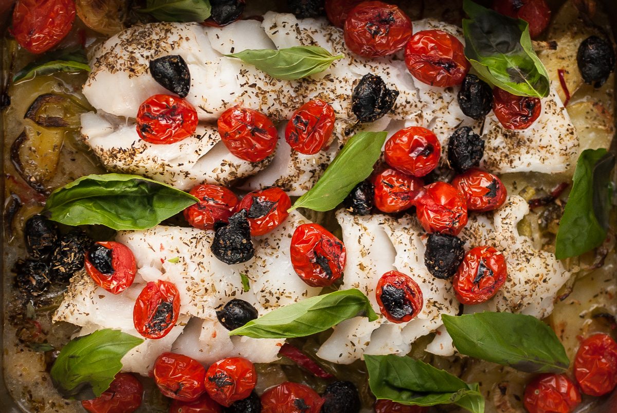 'Here's a healthy, easy Baked Cod recipe from Dad. Delicious fish on the bone that holds in all the juices, garnished with black olives and basil.'