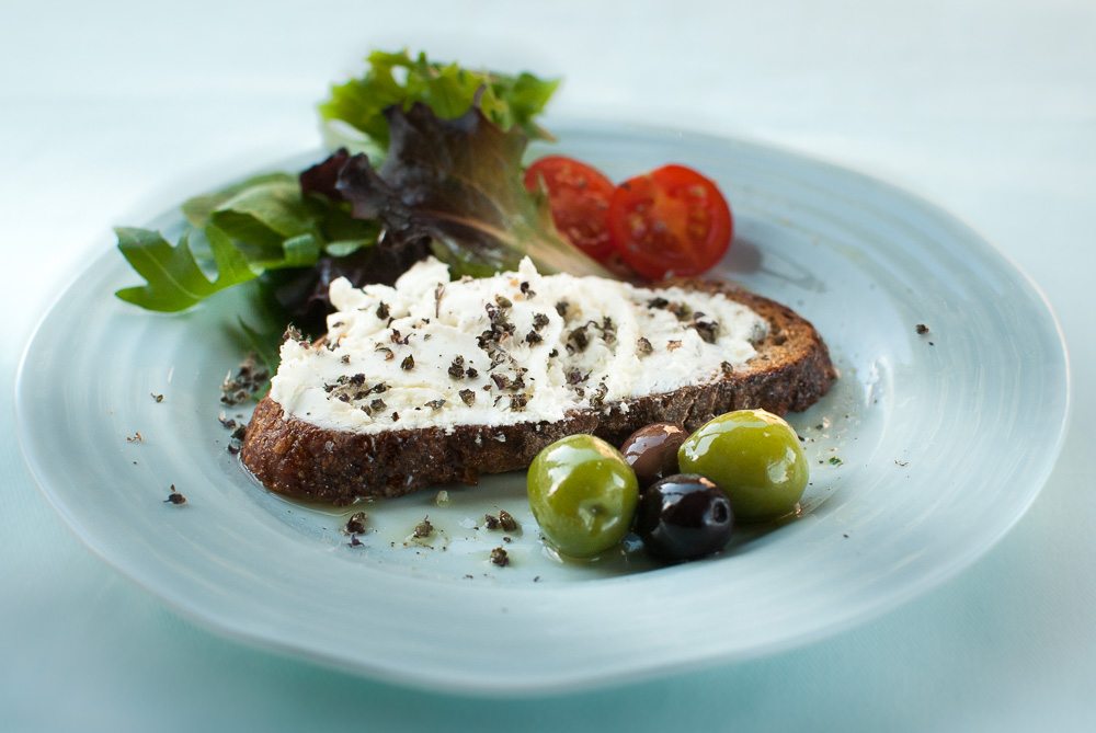 This bruschetta is all about the combination dried basilica citron flowers with goat's cheese.