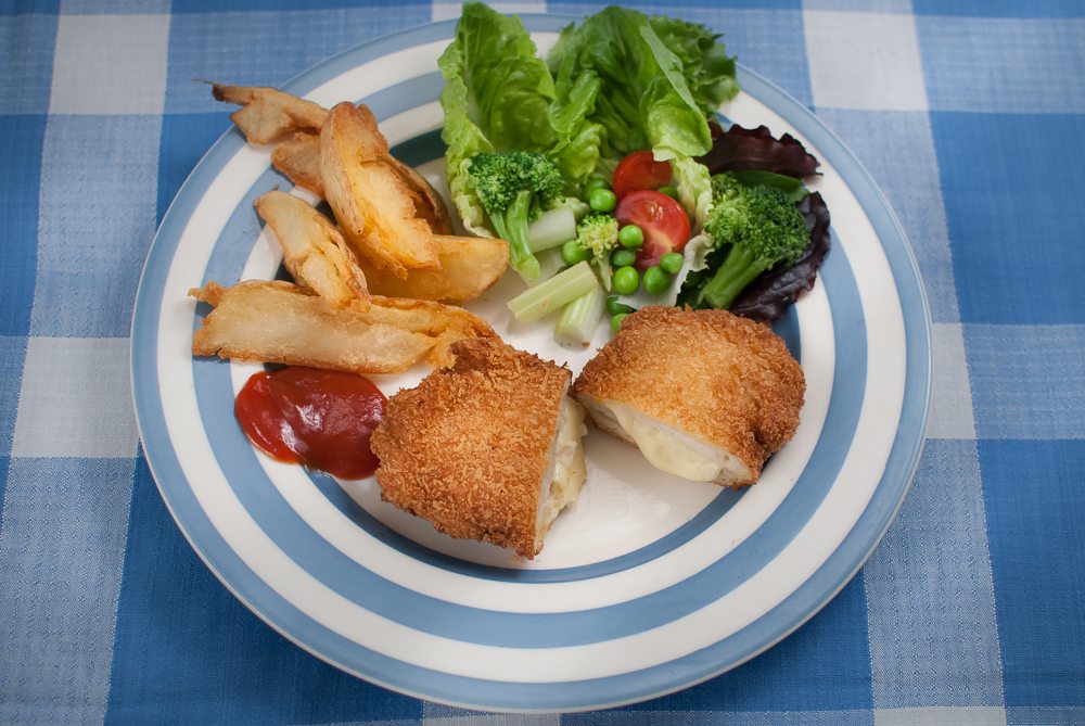 We didn't eat Chicken Kiev when we were growing up - we had cordon bleu instead. They're a lot easier than a Kiev but just as tasty. Great for kids.