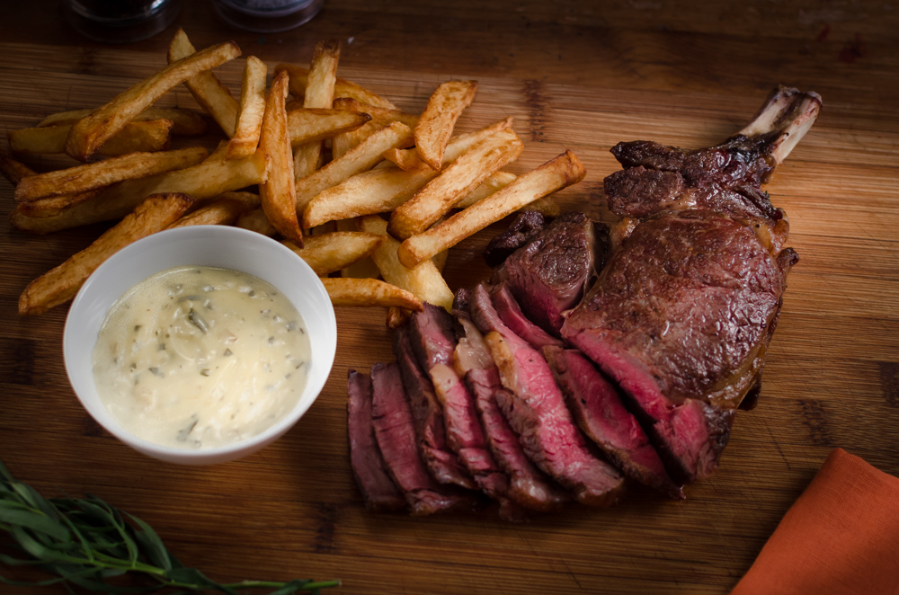 A côte de boeuf is a basically a monster steak with a bone in, or a French version of a rib of beef. But however you want to describe it, it is a wonderful piece of beef. Cook it simply and serve with chips and salad - and my no-split, light and easy béarnaise sauce.