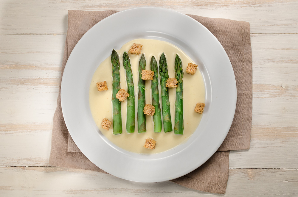 Asparagus goes well with Parmesan cheese. Asparagus also goes well with Taleggio and Gruyèr. It seems we can assume that asparagus works with cheese generally - so why not a fondue? 
