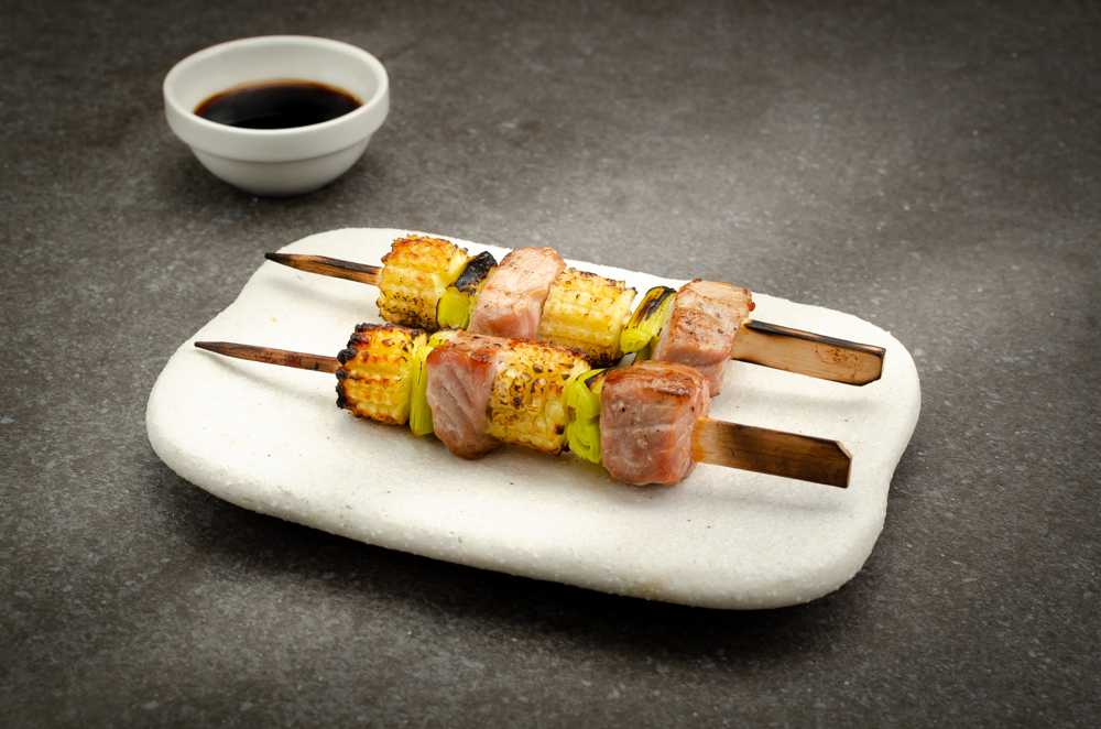 Japanese style barbecued skewers of tuna and babycorn with ponzu sauce