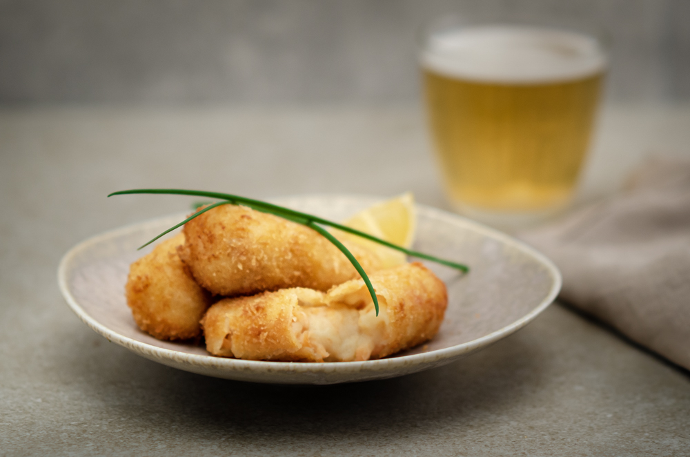 The usual Spanish croqueta is made with jamon. These versions are made with smoked salmon. They work really well and would not go amiss on any tapas menu.