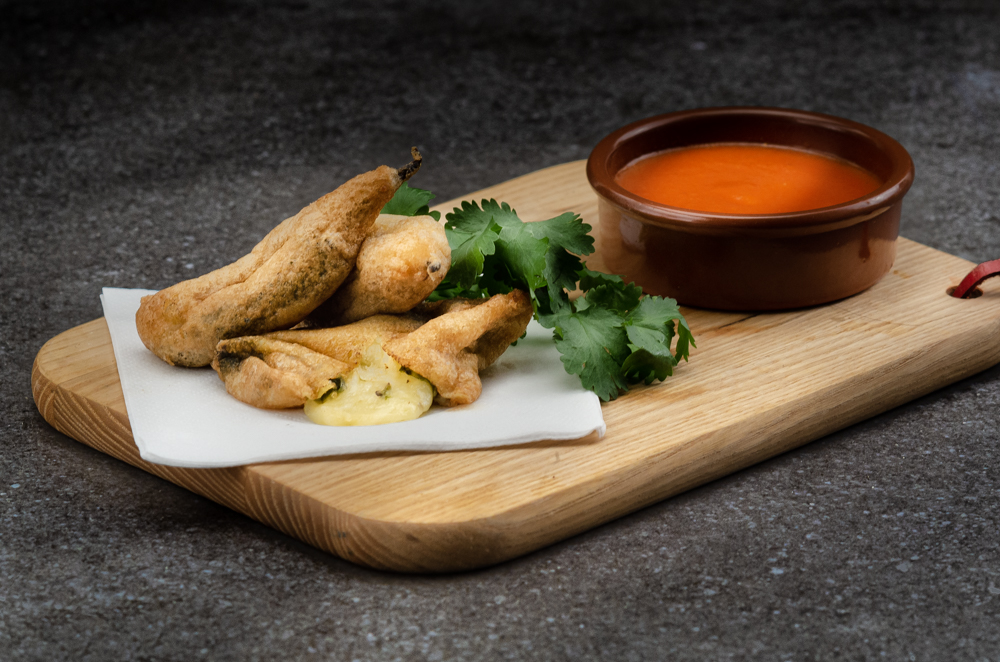 Minature chilli rellenos made with padron peppers.